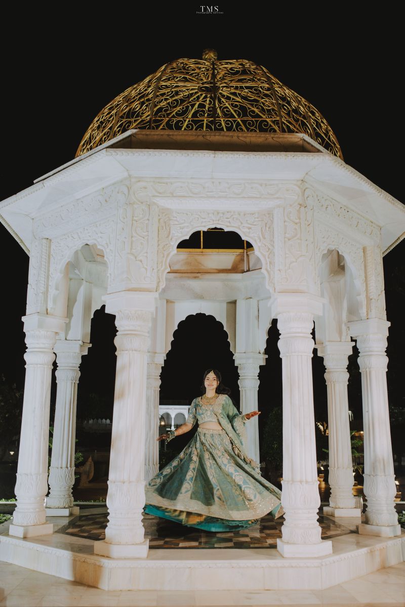 Bridal detail shot capturing mehendi, jewellery, and soft lighting